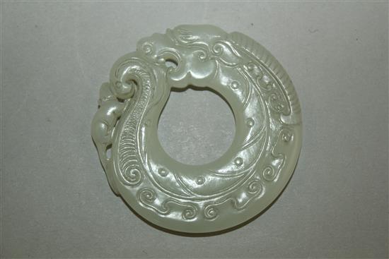 A Chinese archaistic white jade huang disc, 5.5cm